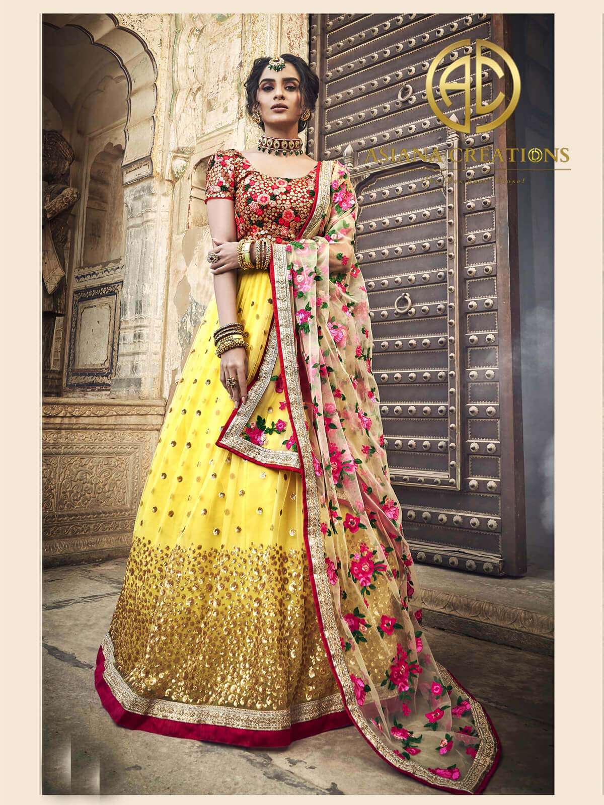 Net Heavy Embroidered Bridal Lehenga Choli in Yellow with Dupatta